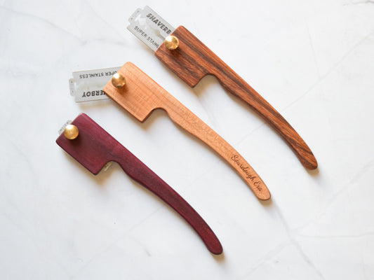 Retractable wooden bread lame with handle, shown in all positions